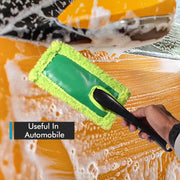 Large, soft microfiber duster trapping dust from a car's exterior for a clean finish.