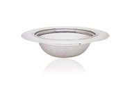 Stainless steel sink strainer effectively catching food particles in a kitchen wash basin drain.